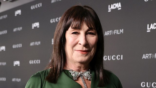 Anjelica Huston wearing green dress