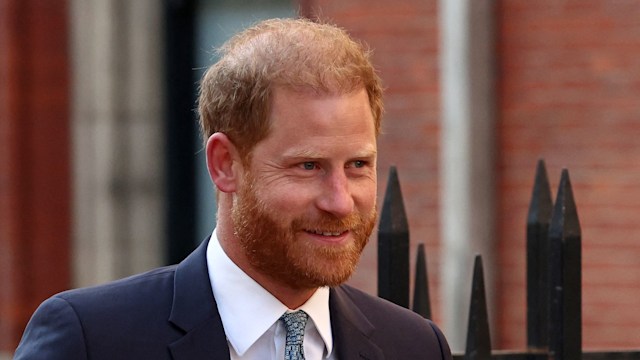 Prince Harry smiling in suit