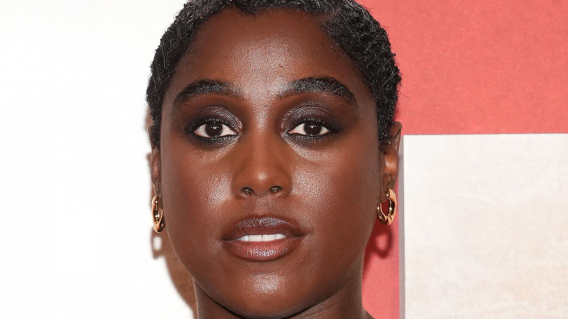 Lashana Lynch glows in pregnancy-friendly dress for rare appearance with husband