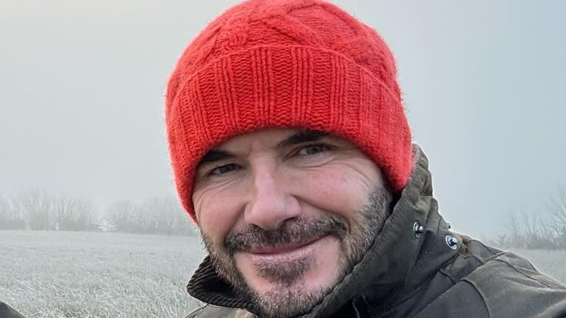 man outside with walking stick 