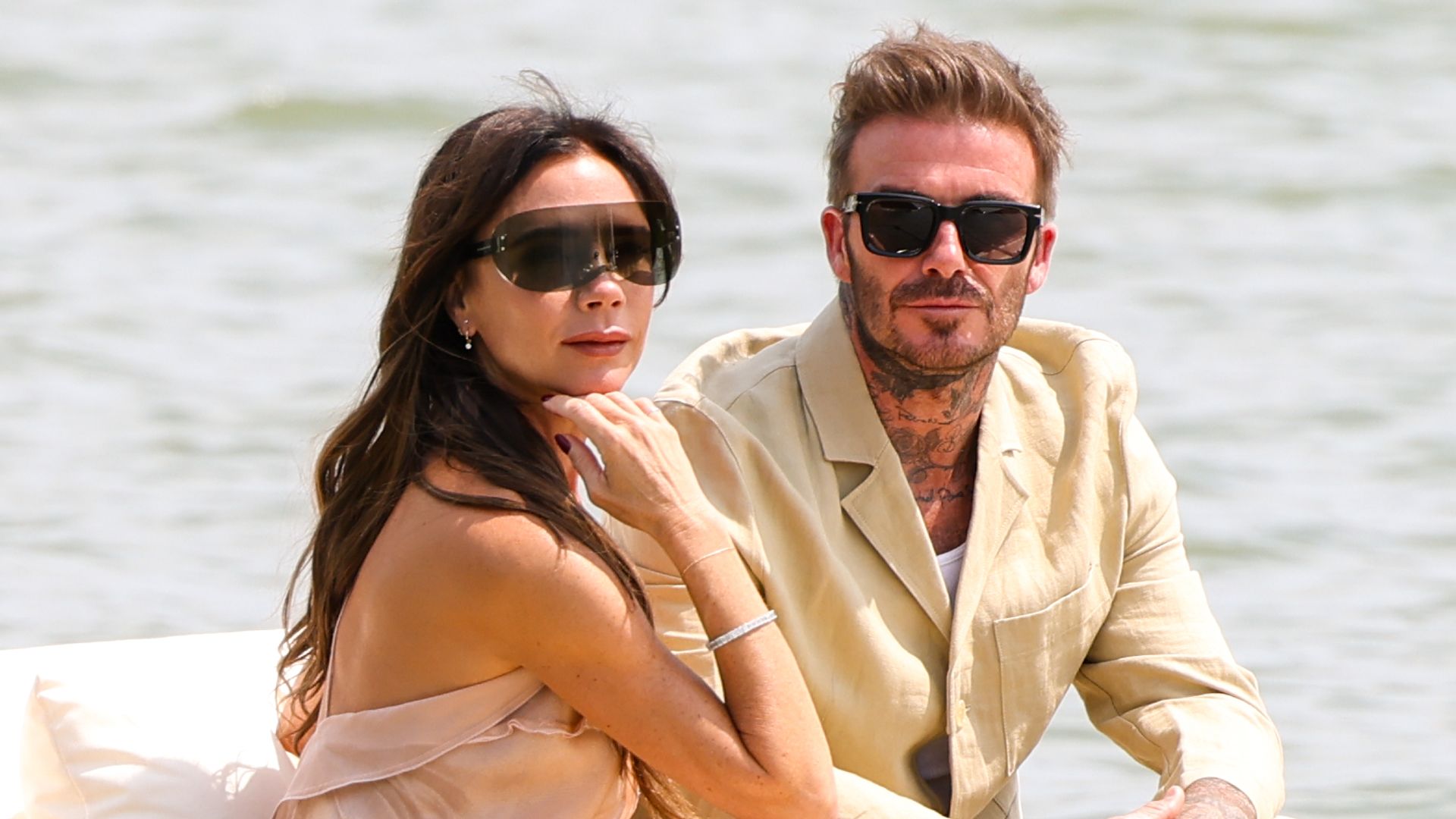 Victoria and David Beckham on a rowing boat 