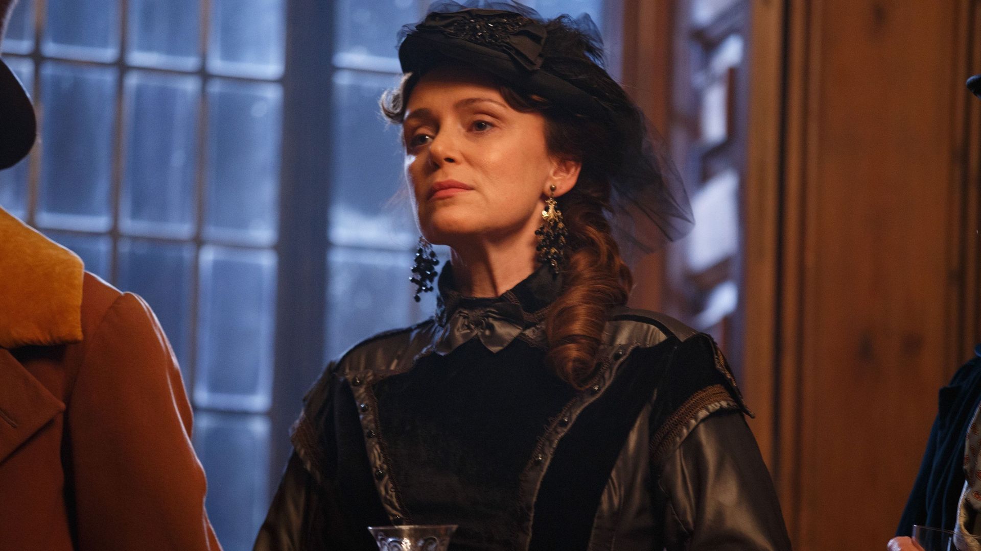 woman dressed in all-black victorian clothing