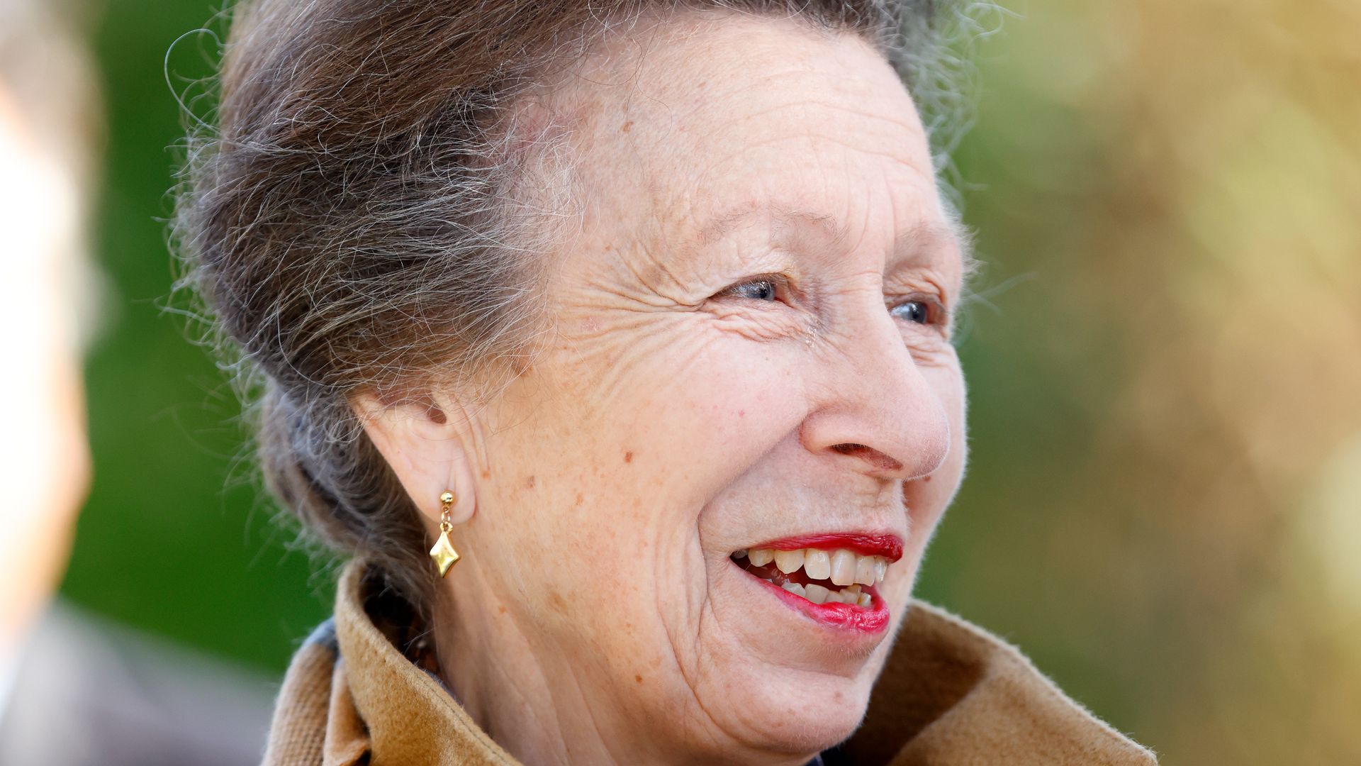 Princess Anne is pristine in structured coat with special jewel