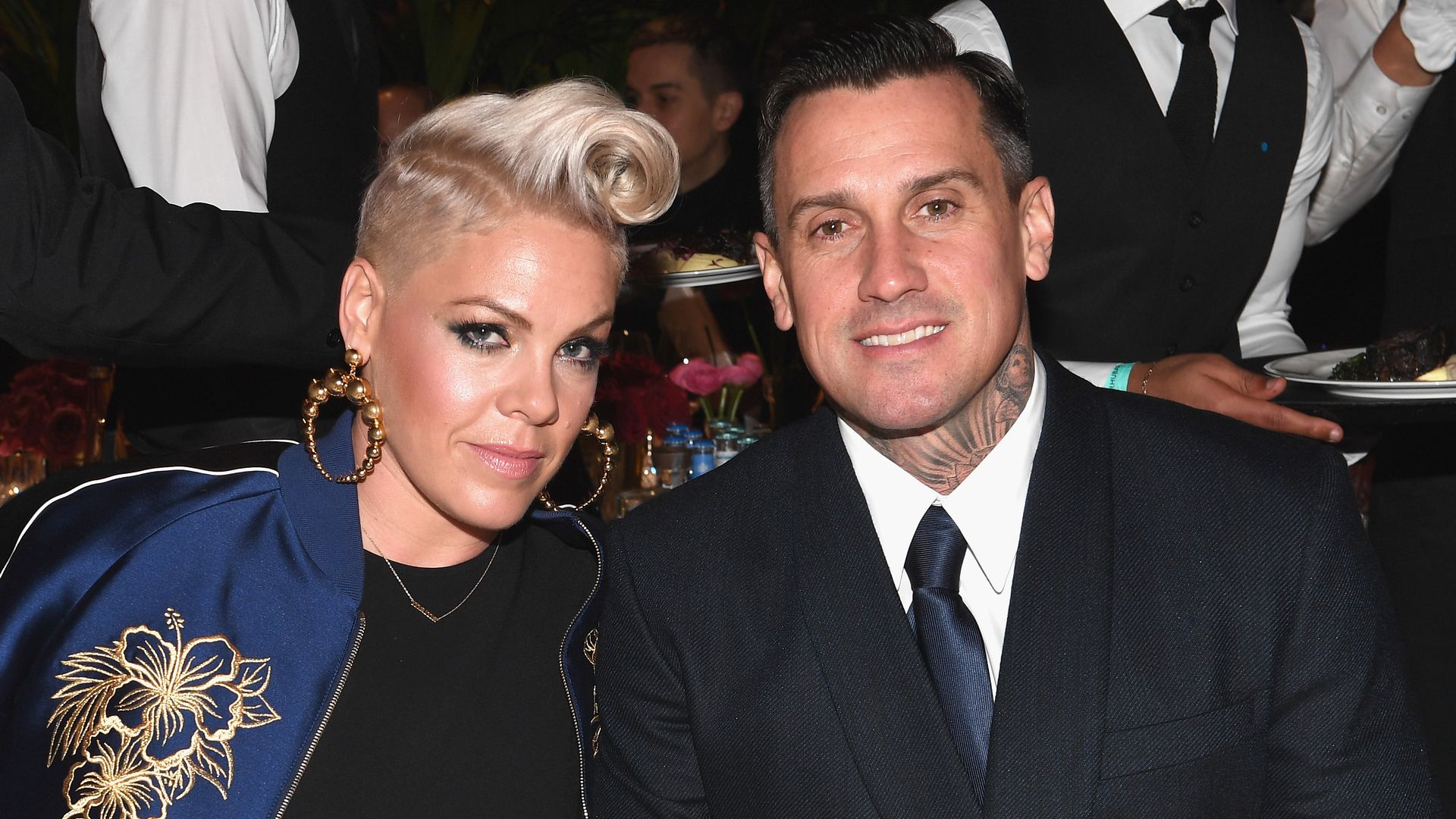 pink sitting at table with carey hart