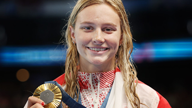 Summer McIntosh of Team Canada is seen with her Gold medal after victory in the Women's 200m Butterfly final