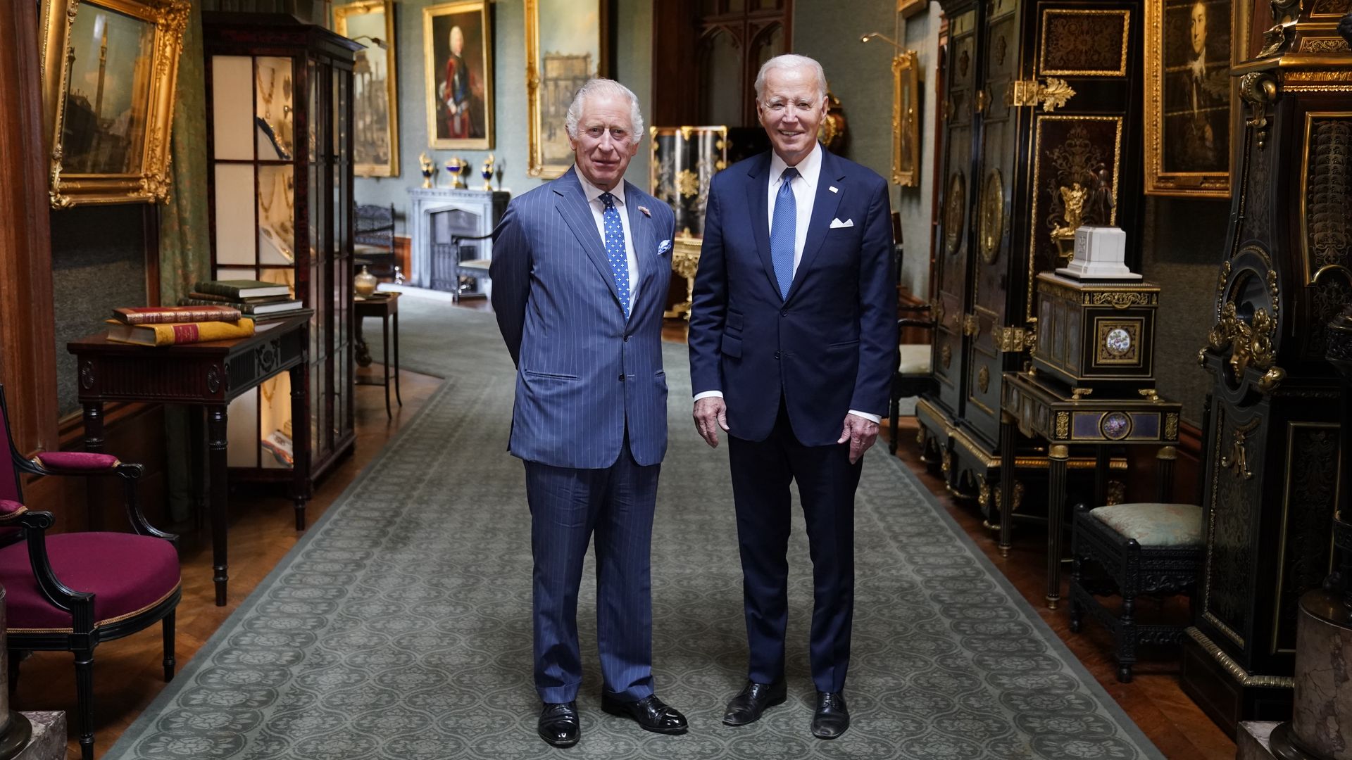 King Charles III and US President Joe Biden pose in the Grand Corridor at Windsor Castle