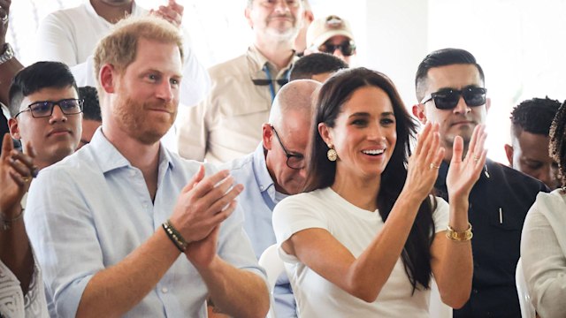 Prince Harry and Meghan Markle clapping