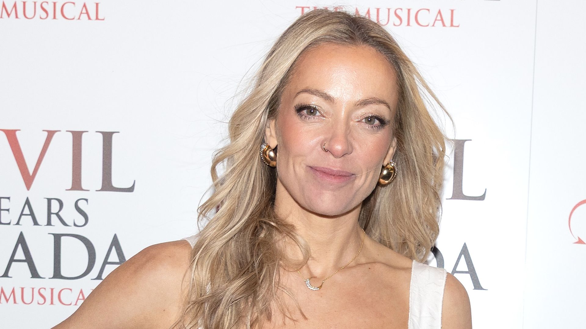 Cherry Healey wearing a white dress