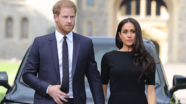 Prince Harry and Meghan Markle looking concerned