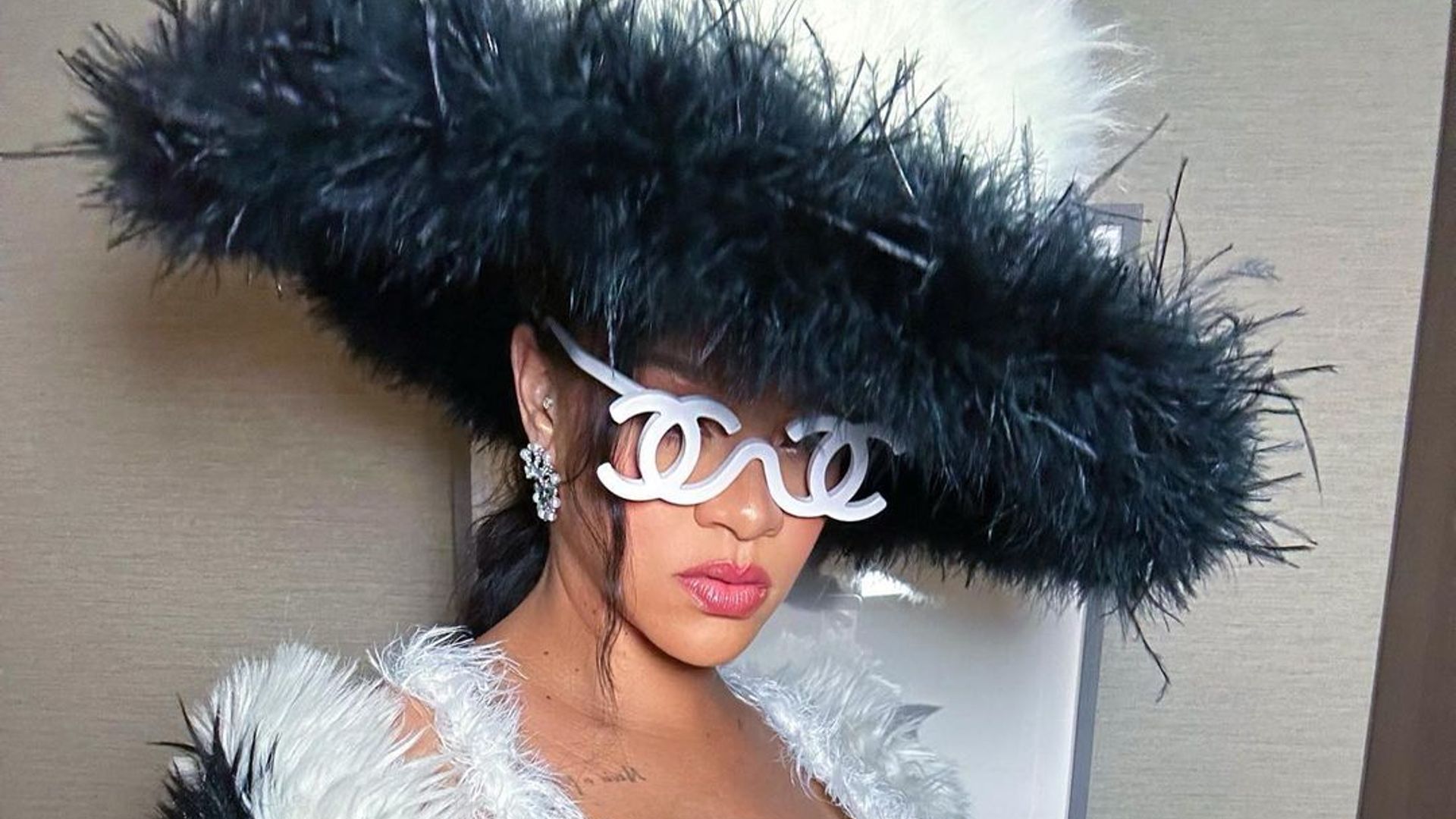 Pregnant Rihanna highlights growing baby bump in furry mini dress as she teases Met Gala look