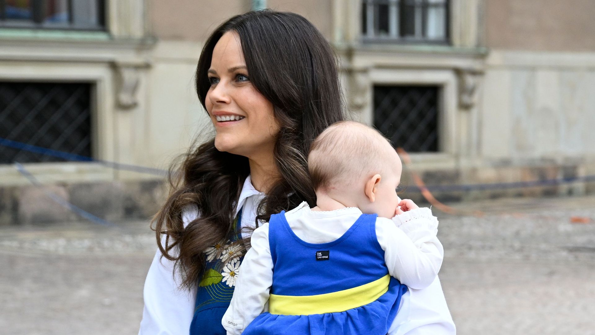 Princess Sofia in traditional dress with baby Ines in her arms