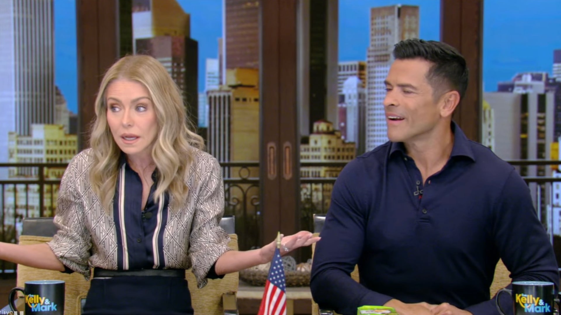 Kelly Ripa reacts to Mark Consuelos’ awkward wardrobe malfunction live on air