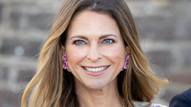 Princess Madeleine smiling in a floral dress