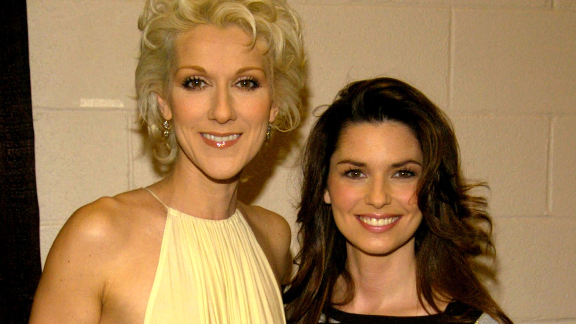 Celine Dion and Shania Twain stood smiling together