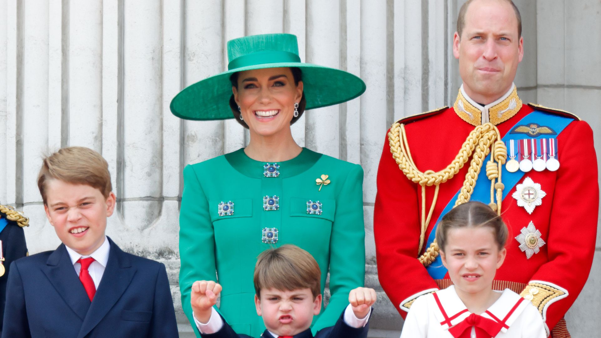 Prince George of Wales, Prince Louis of Wales, Catherine, Princess of Wales (Colonel of the Irish Guards), Princess Charlotte of Wales and Prince William, Prince of Wales (Colonel of the Welsh Guards) watch an RAF flypast