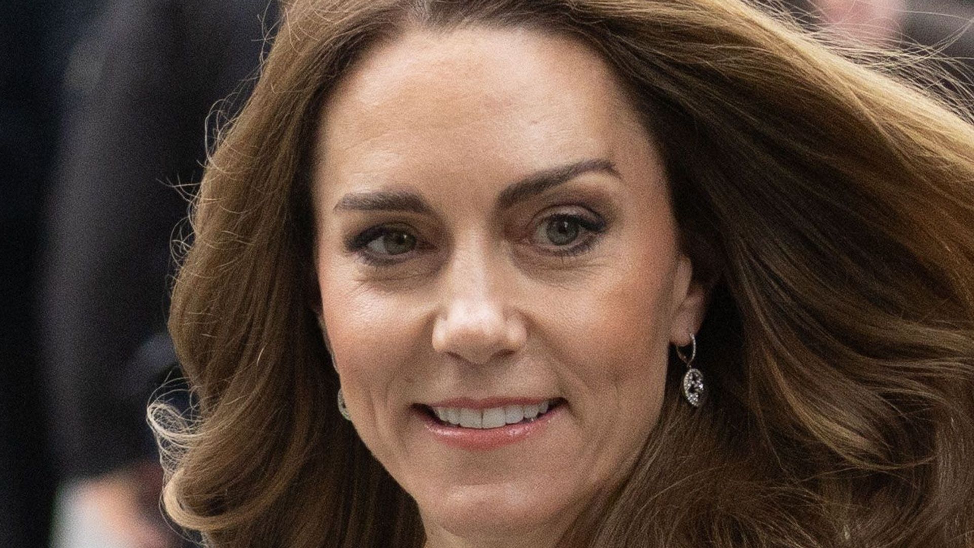 Princess of Wales with hair billowing in wind