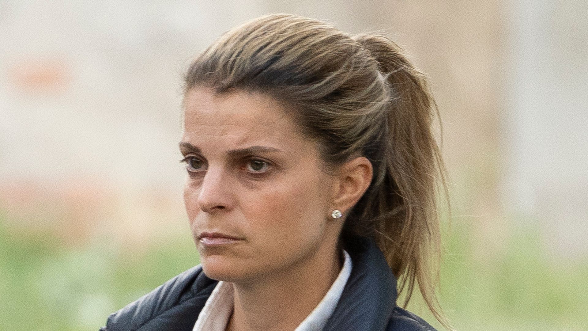 Athina Onassis in a puffer jacket and white shirt