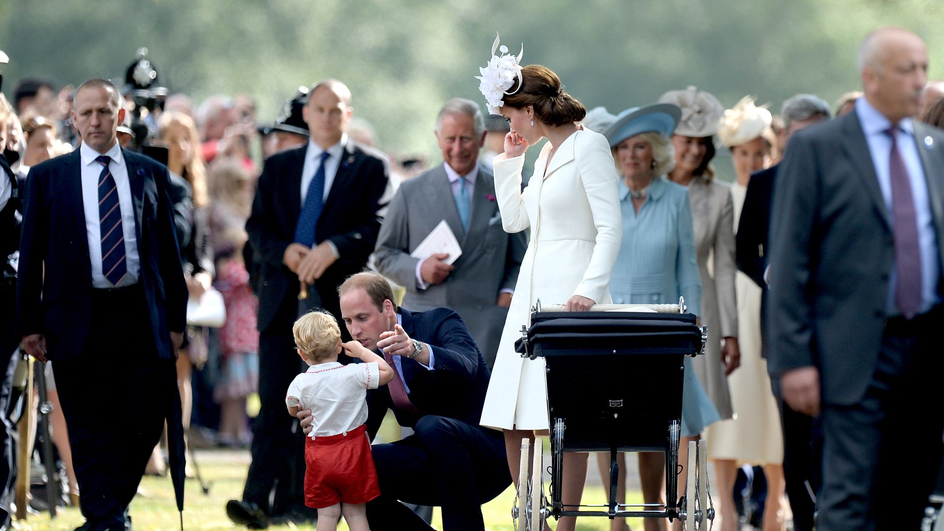 William comforting George at Charlotte's christening