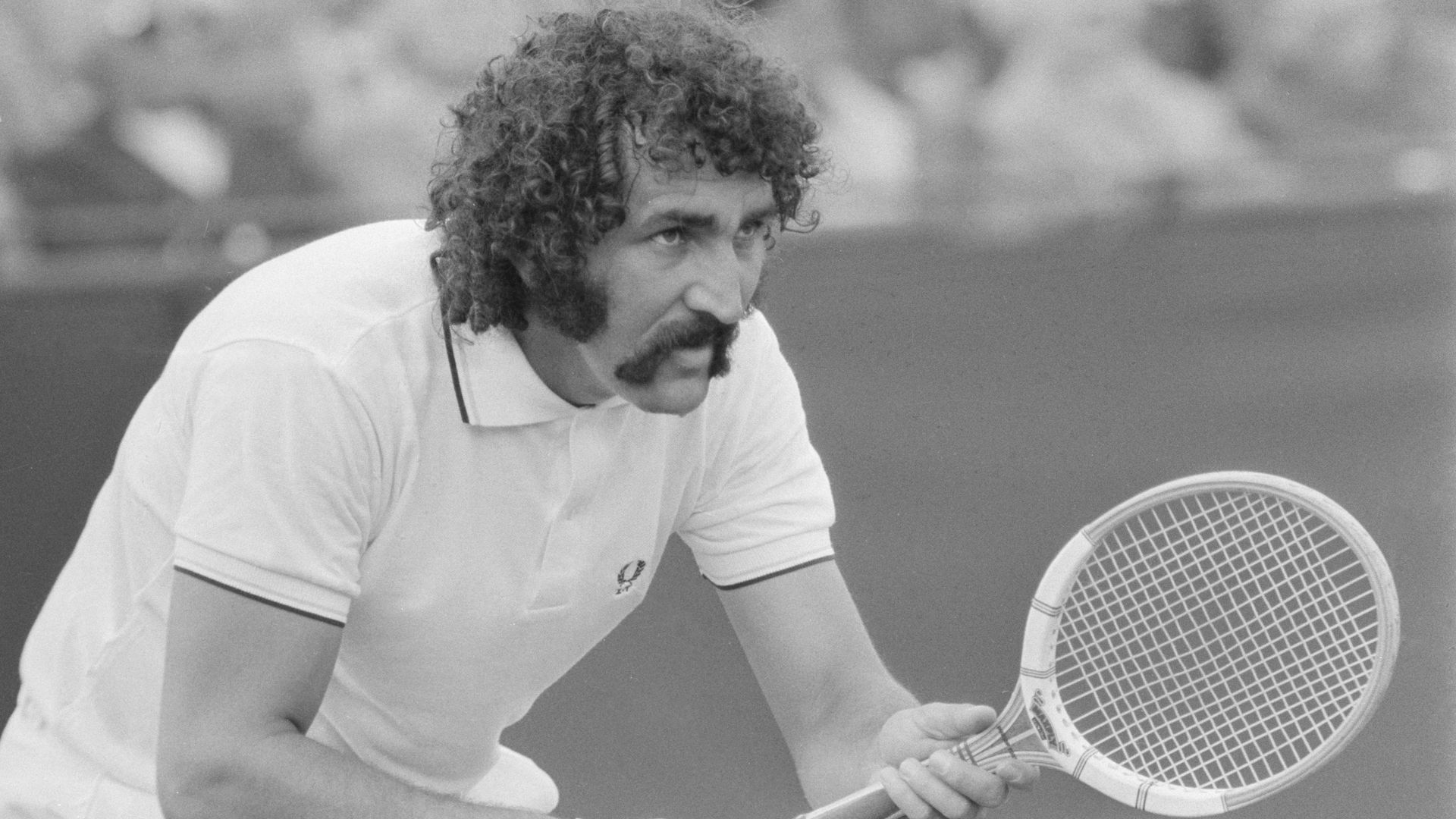 Ion Tiriac playing tennis