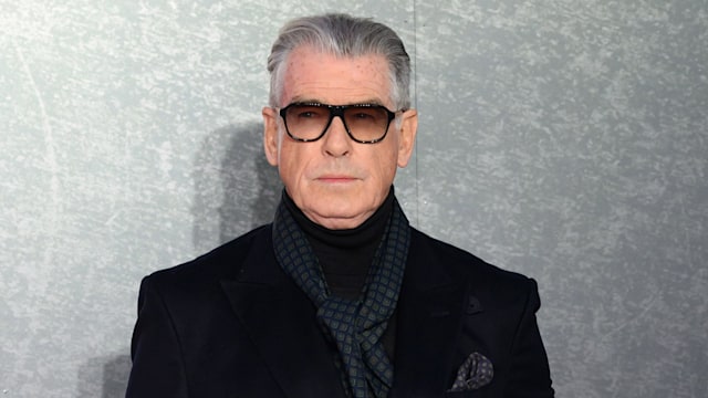 pierce brosnan in suit and glasses