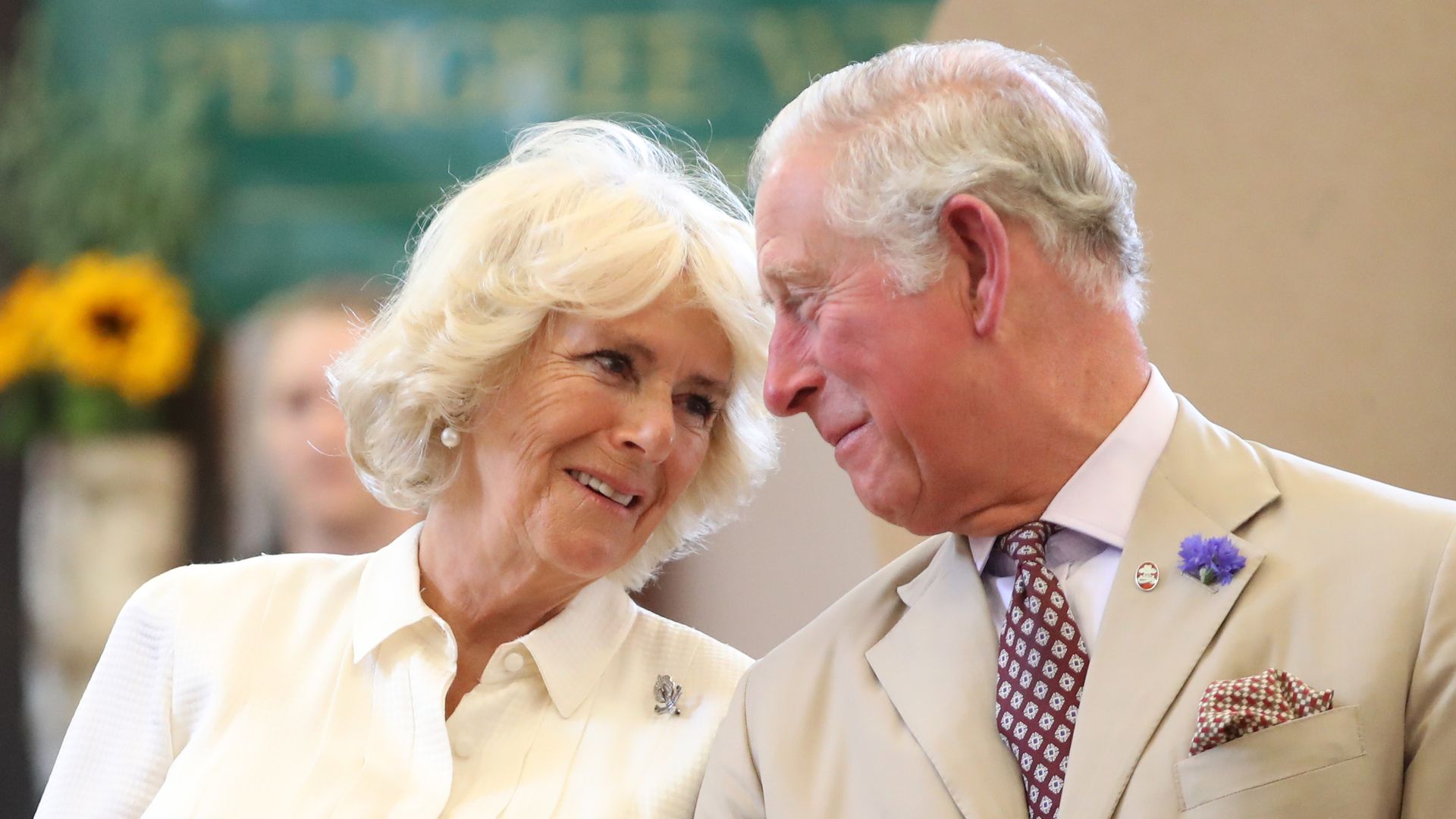 Charles and Camilla look at each other as they reopen the newly-renovated Edwardian community hall The Strand Hall