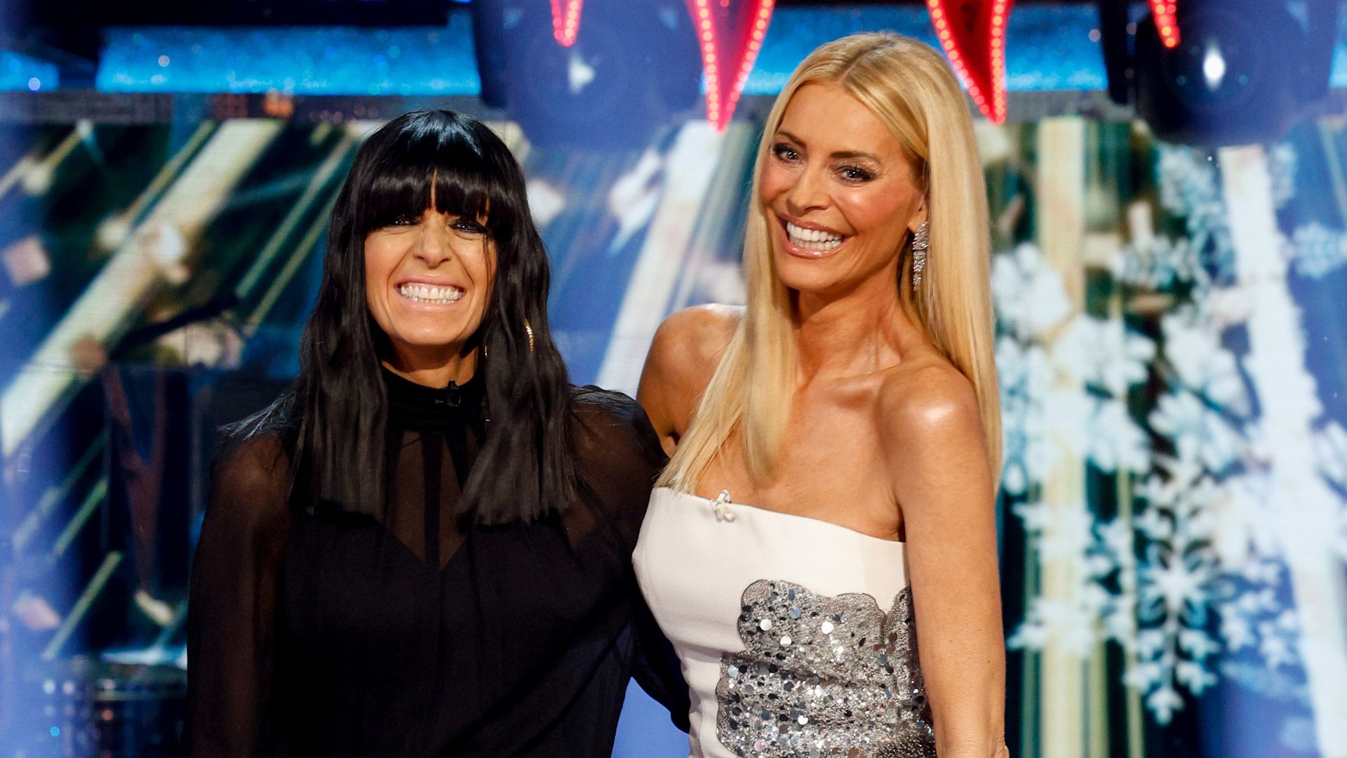 two presents standing on stage 