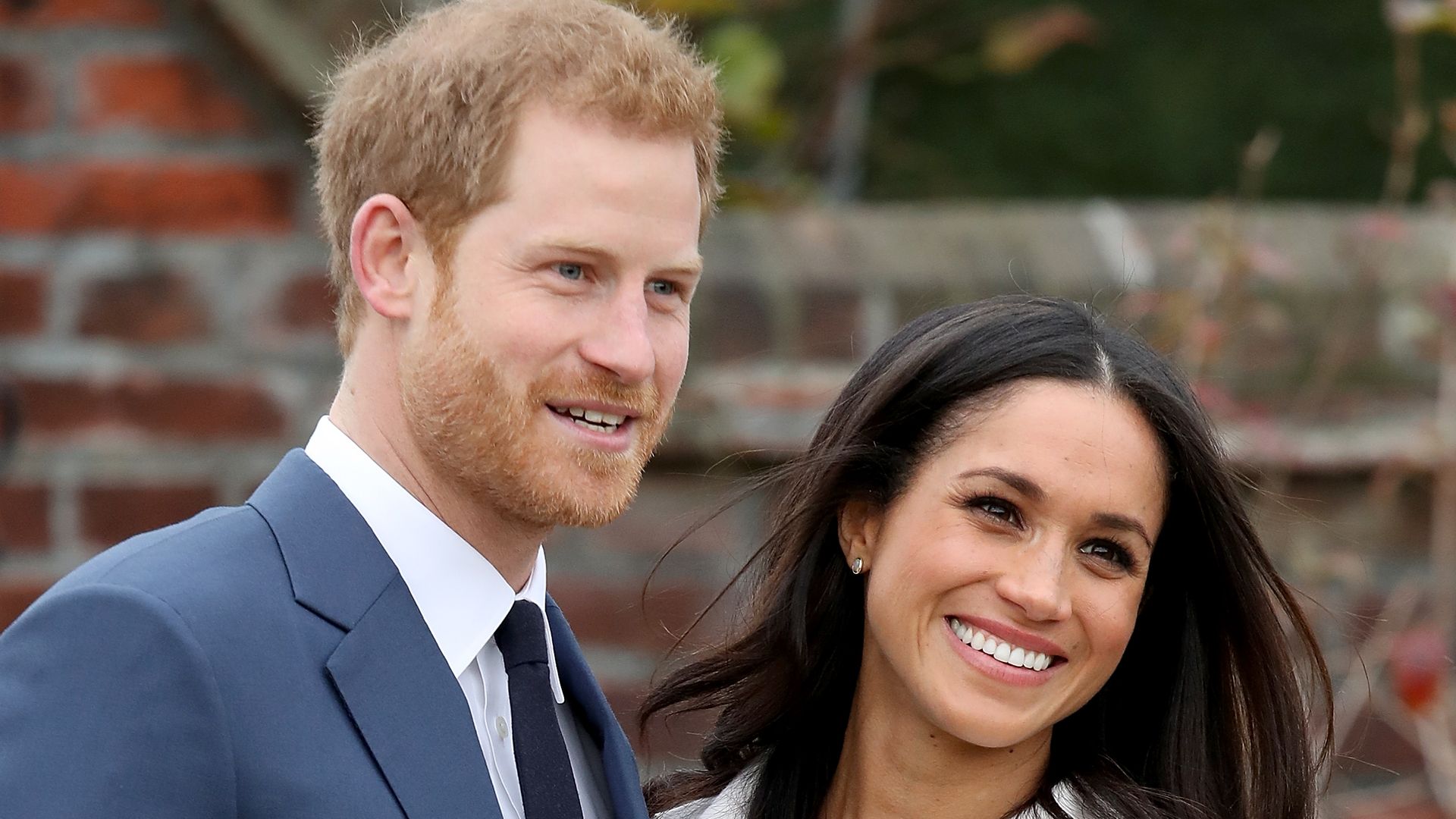 Prince Harry and Meghan Markle during an official photocall to announce their engagement at Kensington Palace in 2017