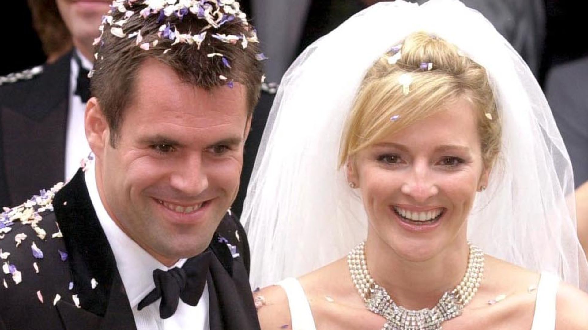 Gabby Logan was all smiles in cascading bridal dress and pearl choker on wedding day