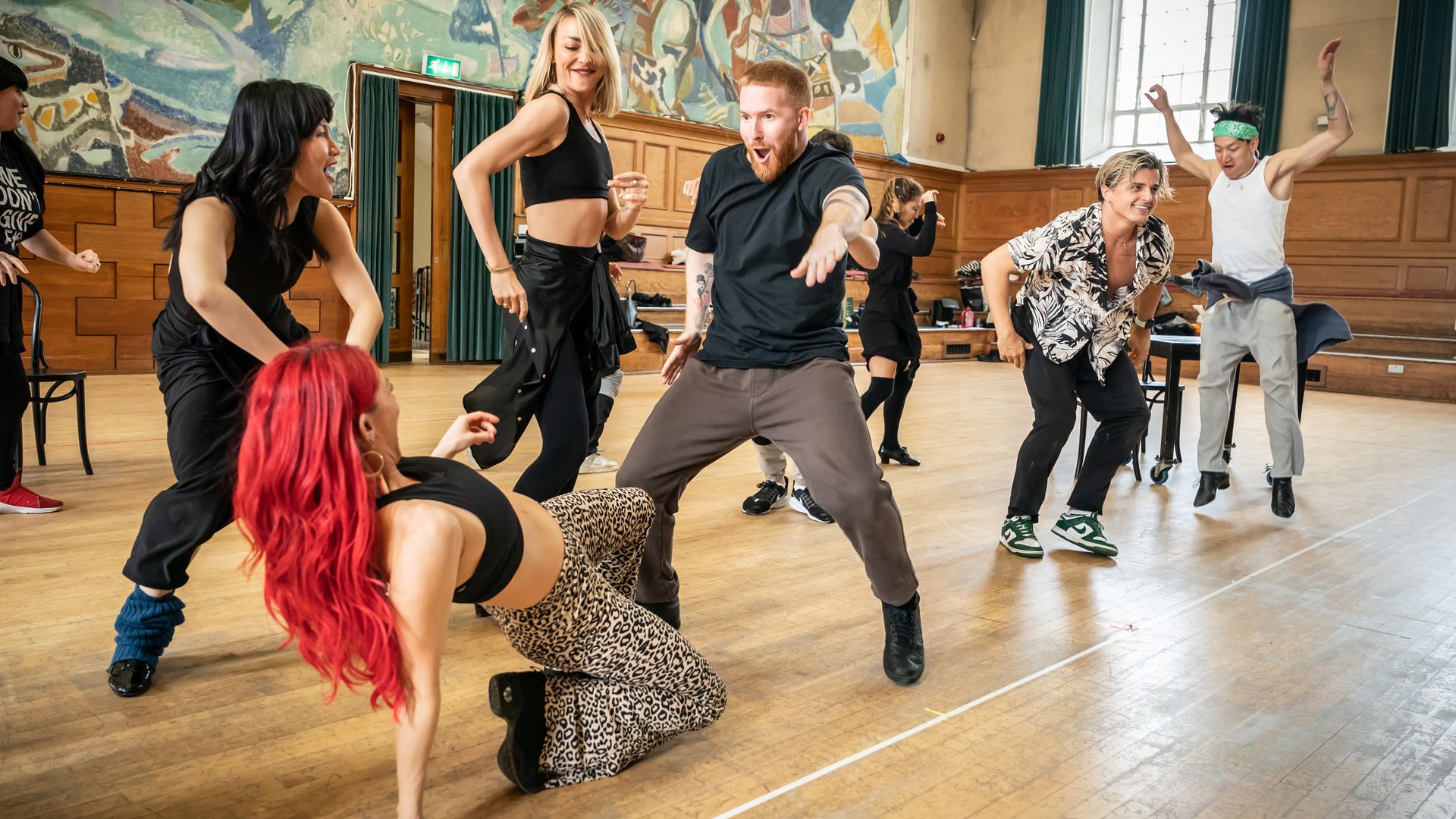 Dianne Buswell dances on the floor while Neil Jones gets his groove on during Strictly rehearsals