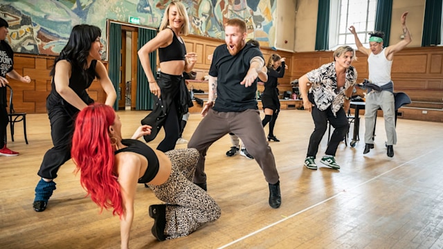 Dianne Buswell dances on the floor while Neil Jones gets his groove on during Strictly rehearsals