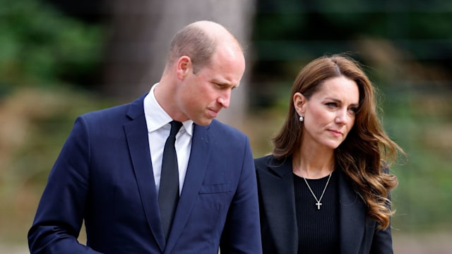 Prince William, Prince of Wales and Catherine, Princess of Wales view floral tributes left at the entrance to Sandringham House