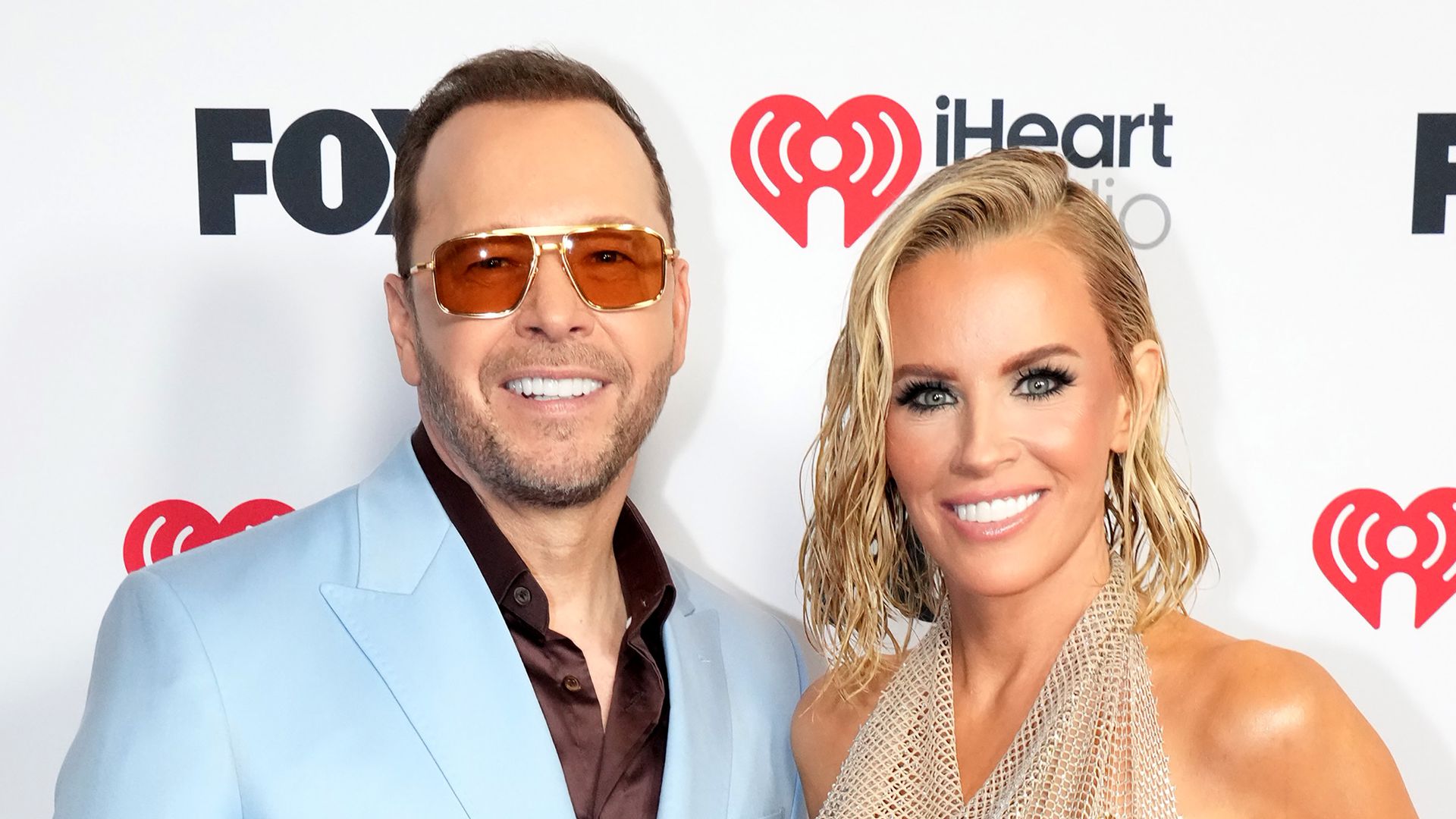 Jenny McCarthy displays dramatic weight loss in tiny red bikini alongside ripped husband Donnie Wahlberg