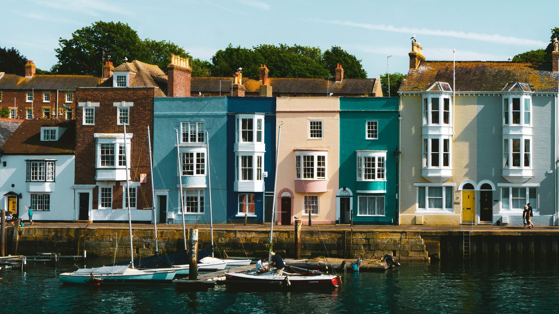 Pastel houses lined along Weymouth Harbour