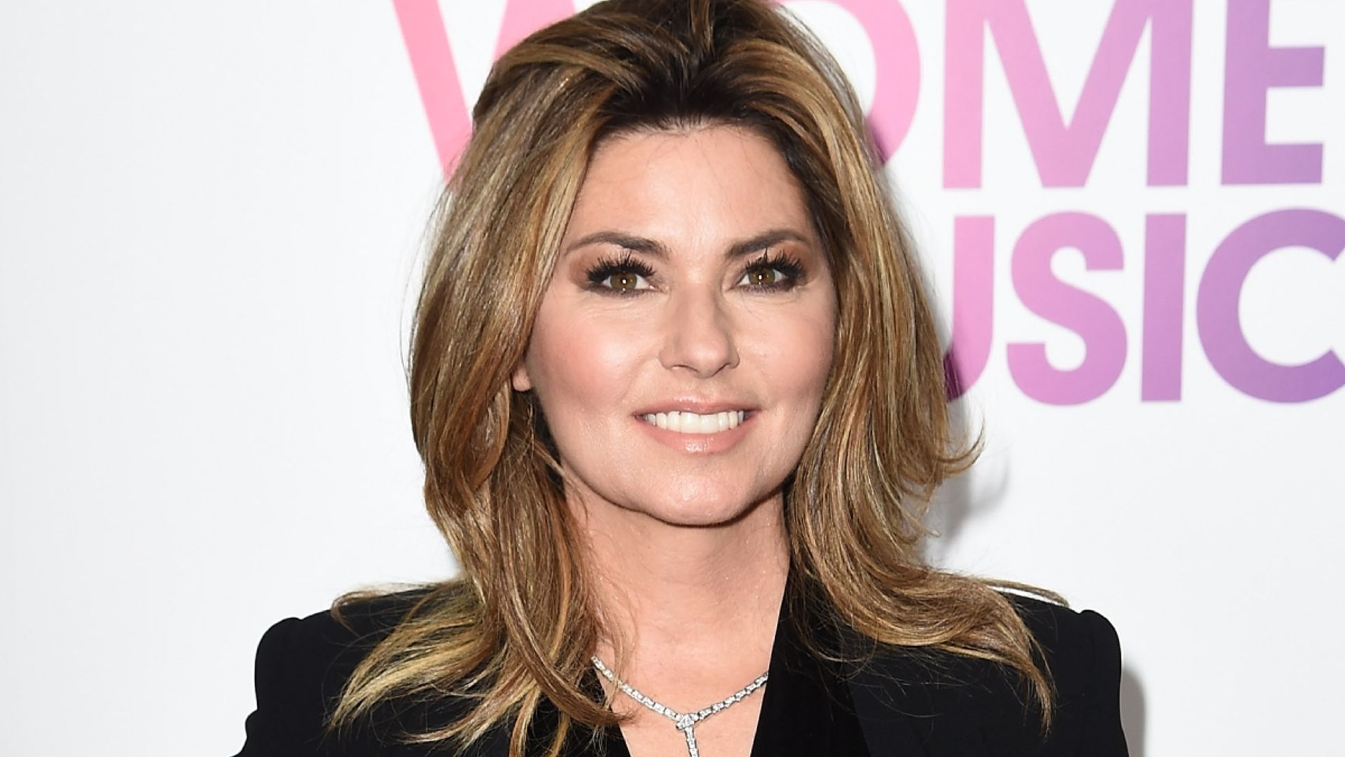Shania Twain brings the country glamor in shimmery outfit as she shares exciting news