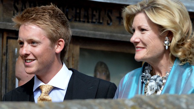 Hugh Grosvenor in a suit with his mother Natalia