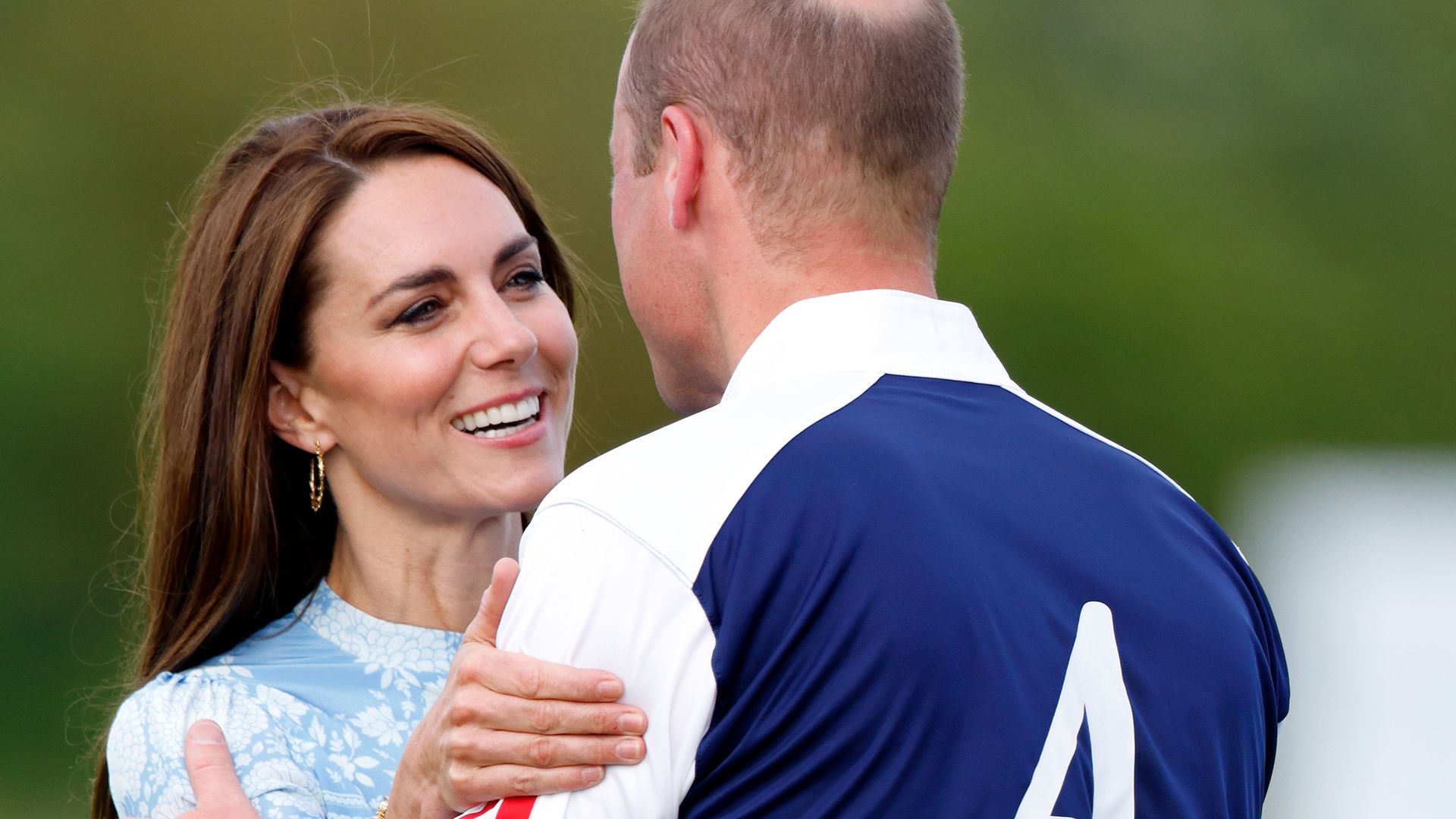 The Princess of Wales embraces Prince William, Prince of Wales during the prize giving following the Out-Sourcing Inc. Royal Charity Polo Cup 2023 at Guards Polo Club, Flemish Farm on July 6, 2023