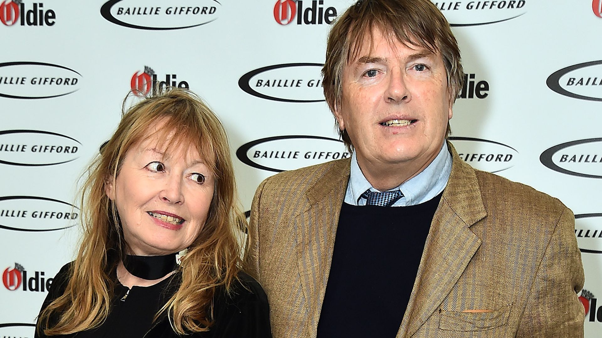 Giles Wood in a brown suit jacket and Mary Killen in a floral dress