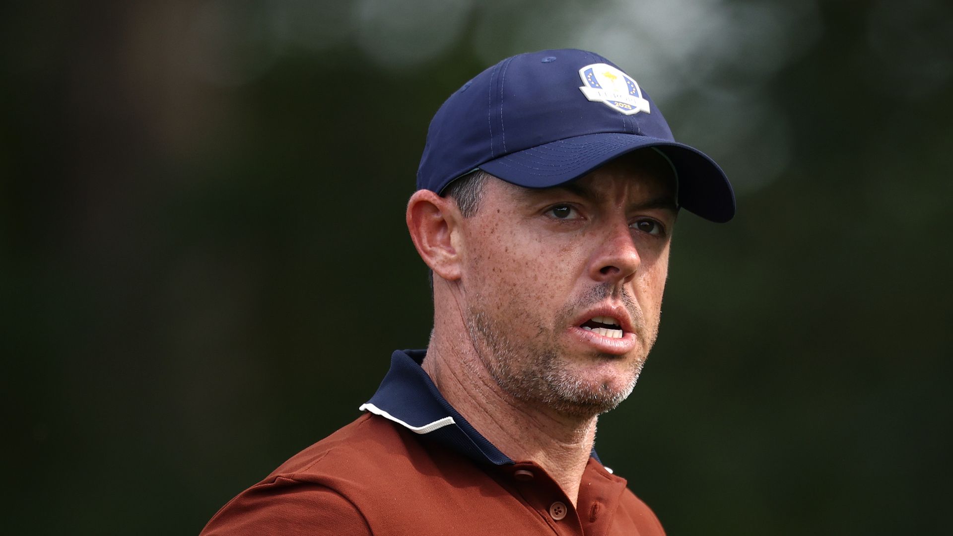 Rory McIlroy of Team Europe leaves the 12th tee during the Saturday afternoon four-balls matches of the 2025 Ryder Cup at Black Course at Bethpage State Park Golf Course on September 27, 2025 in Farmingdale, New York.