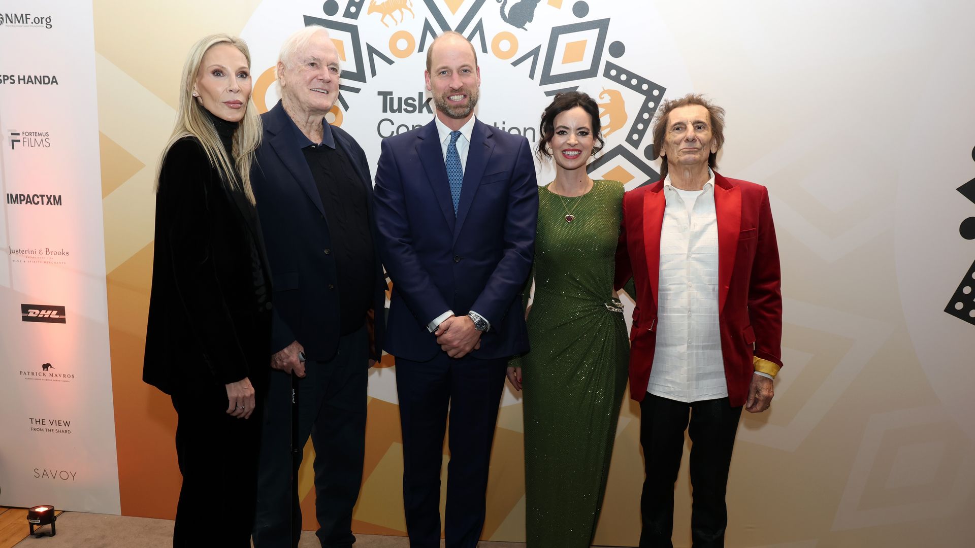 Prince William standing with Jennifer Wade, John Cleese and Ronnie and Sally Wood