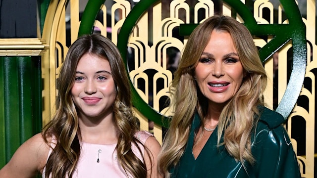 mother and daughter on green carpet