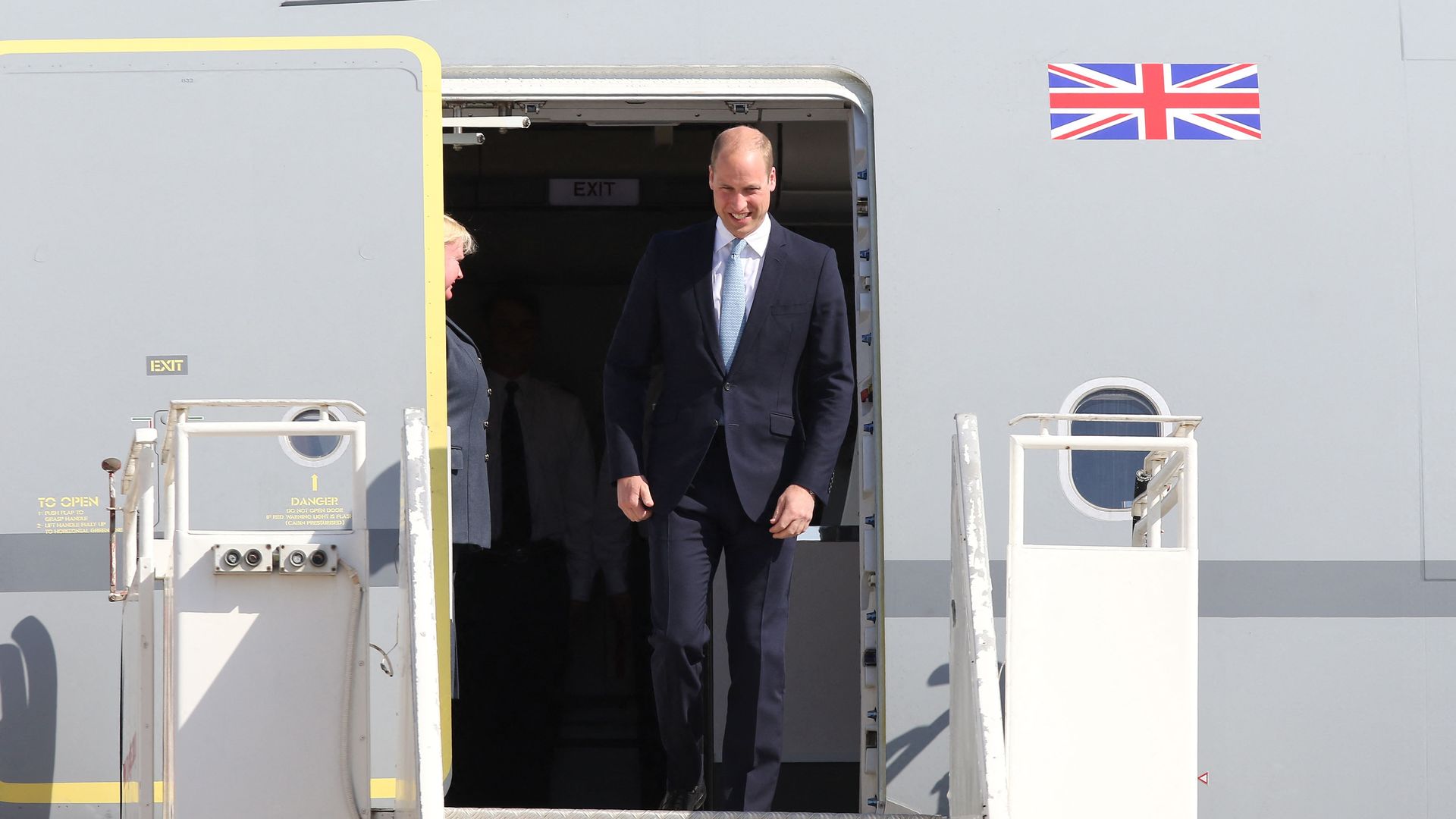 Prince William disembarking from a plane