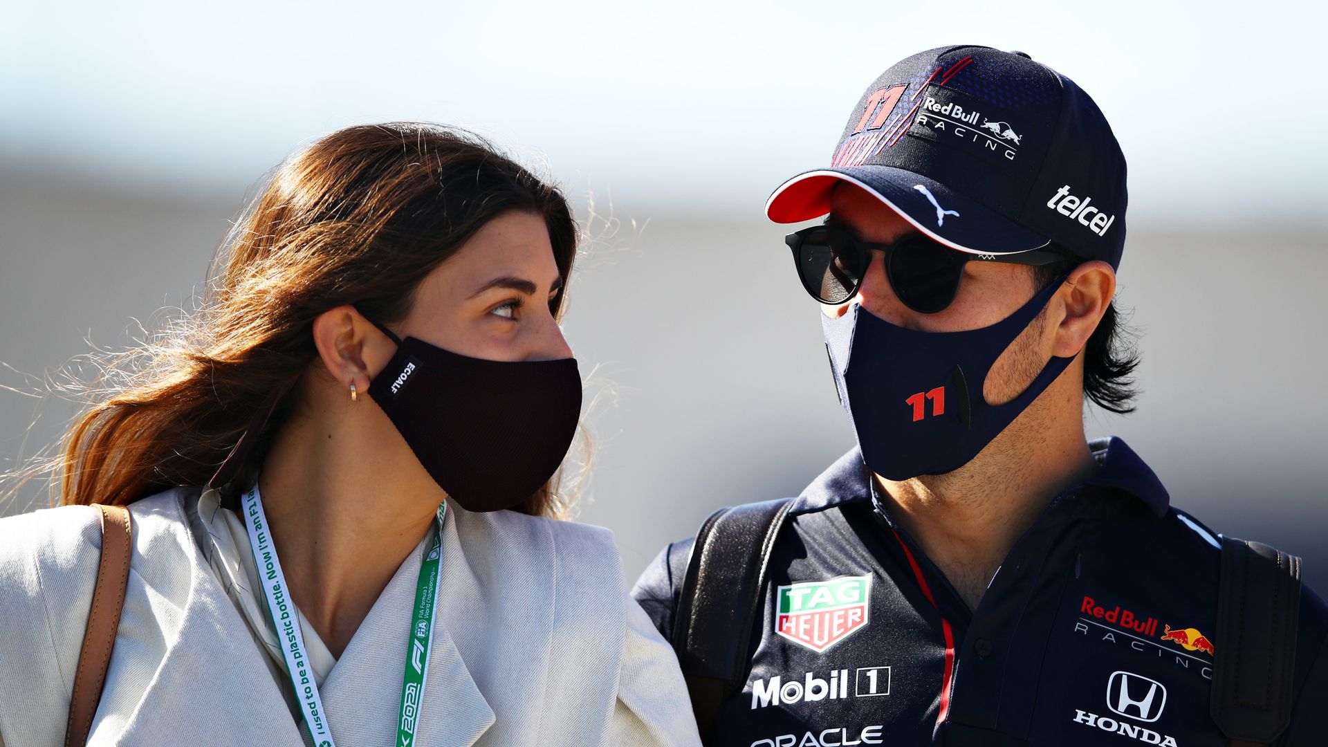 Sergio Perez and Carola Martinez walking in face masks