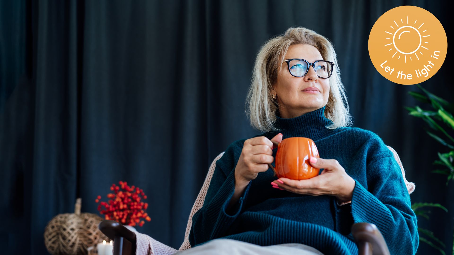 Woman drinking tea from an autumn mug