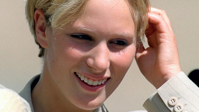 Zara Tindall pushing her pixie cut hair behind her ear