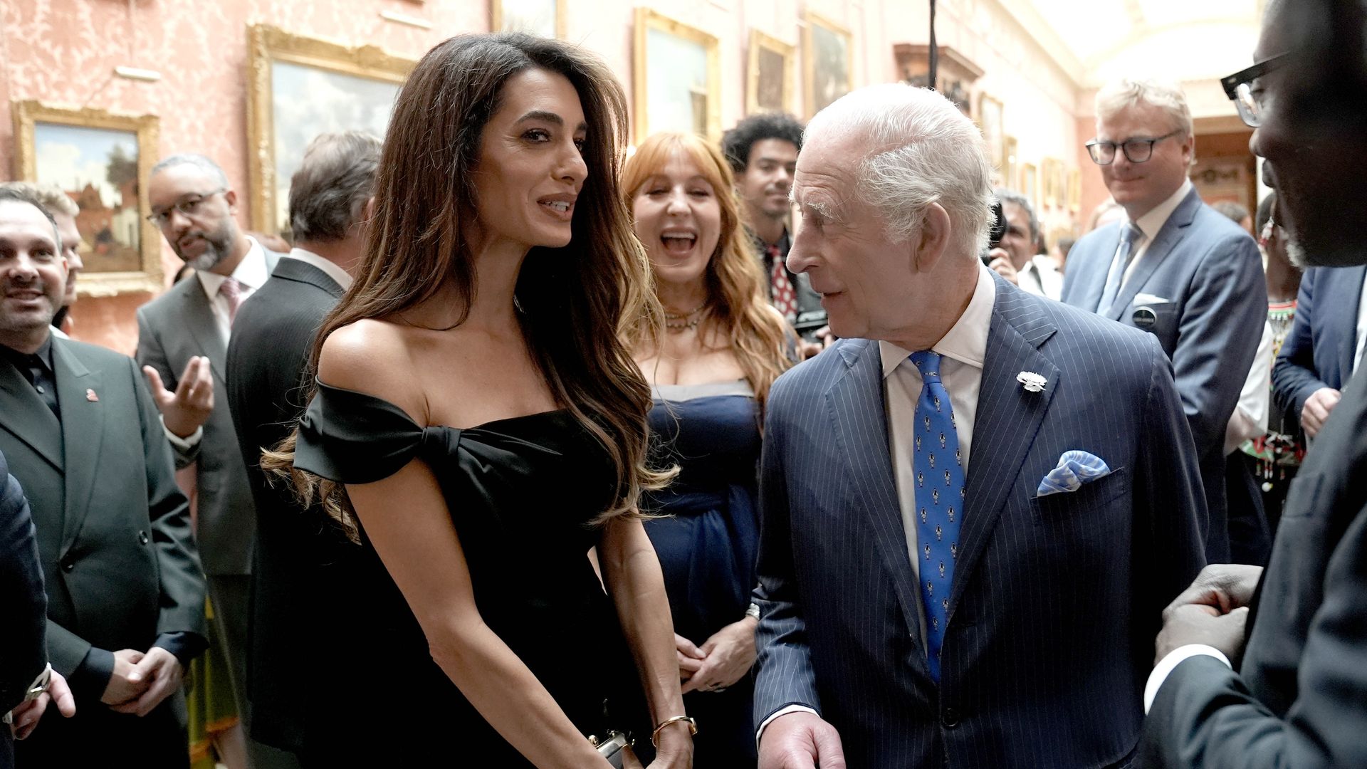 Amal Clooney speaks with King Charles