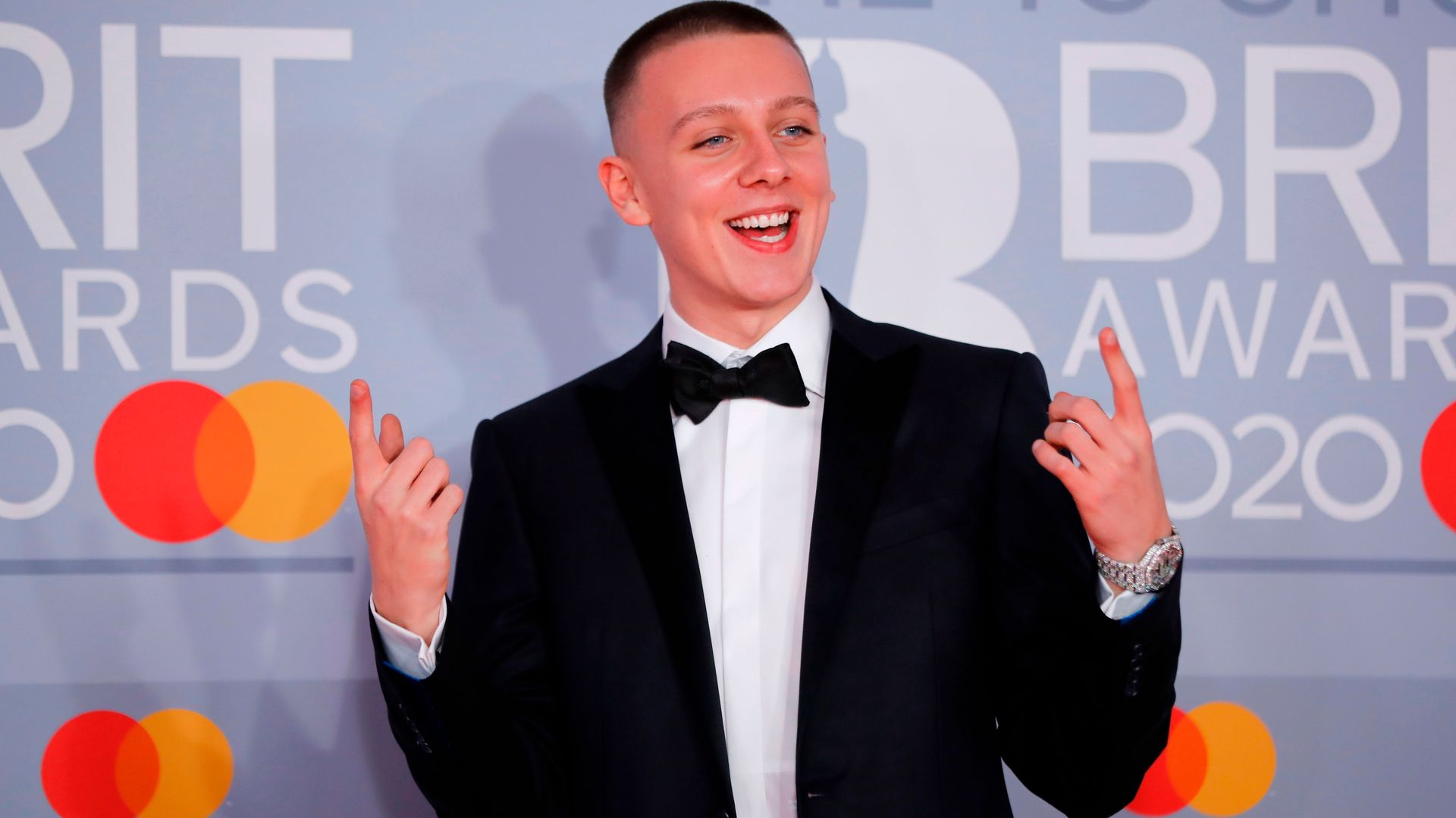 Aitch posing on the red carpet