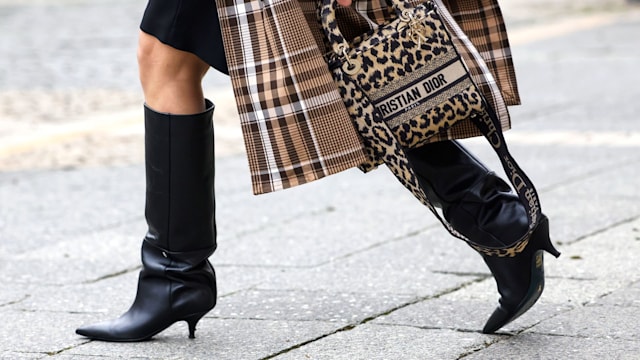  A leopard print bag by Dior and black knee high boots by Patrizia Pepe as a detail of influencer Simone Adams, seen during the Frankfurt Fashion Week January 2022 on January 18, 2022 in Frankfurt am Main, Germany. (Photo by Streetstyleshooters/Getty Images)