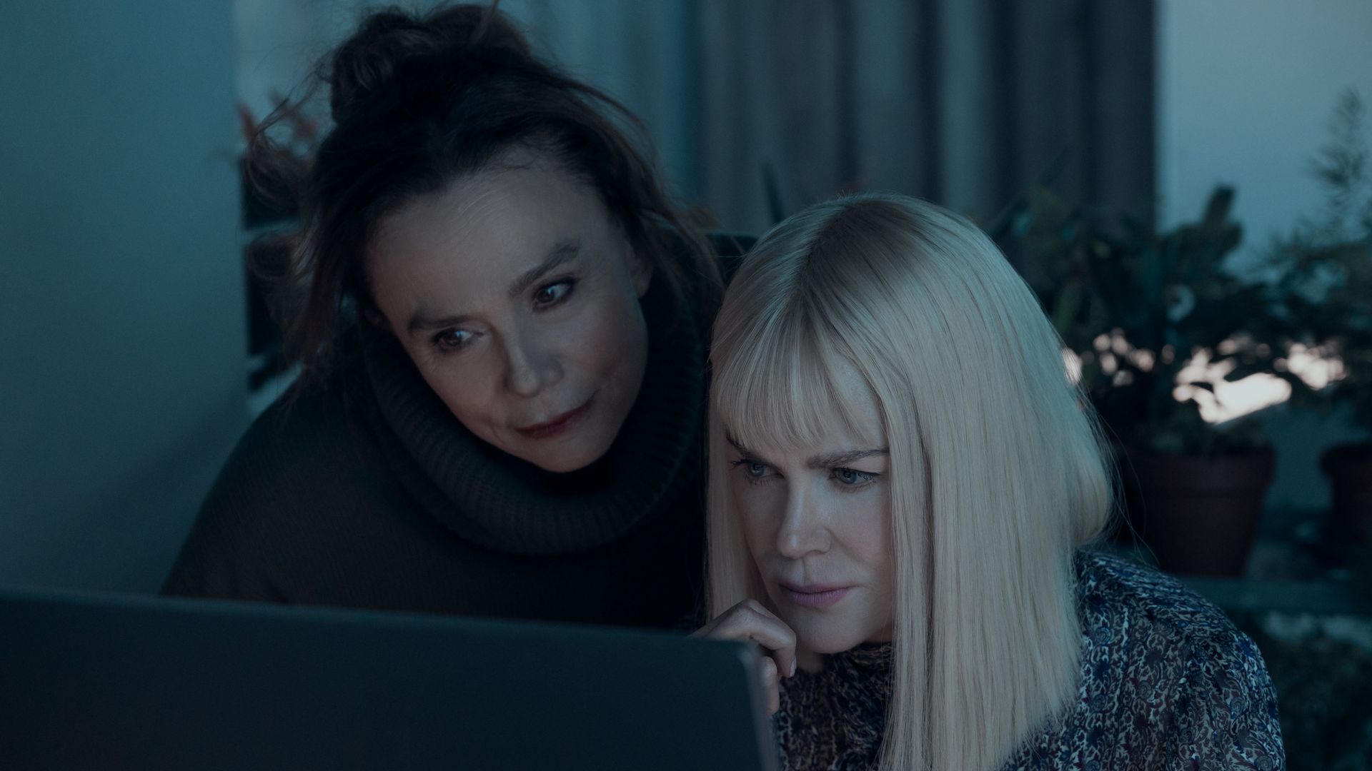 two women looking at computer screen