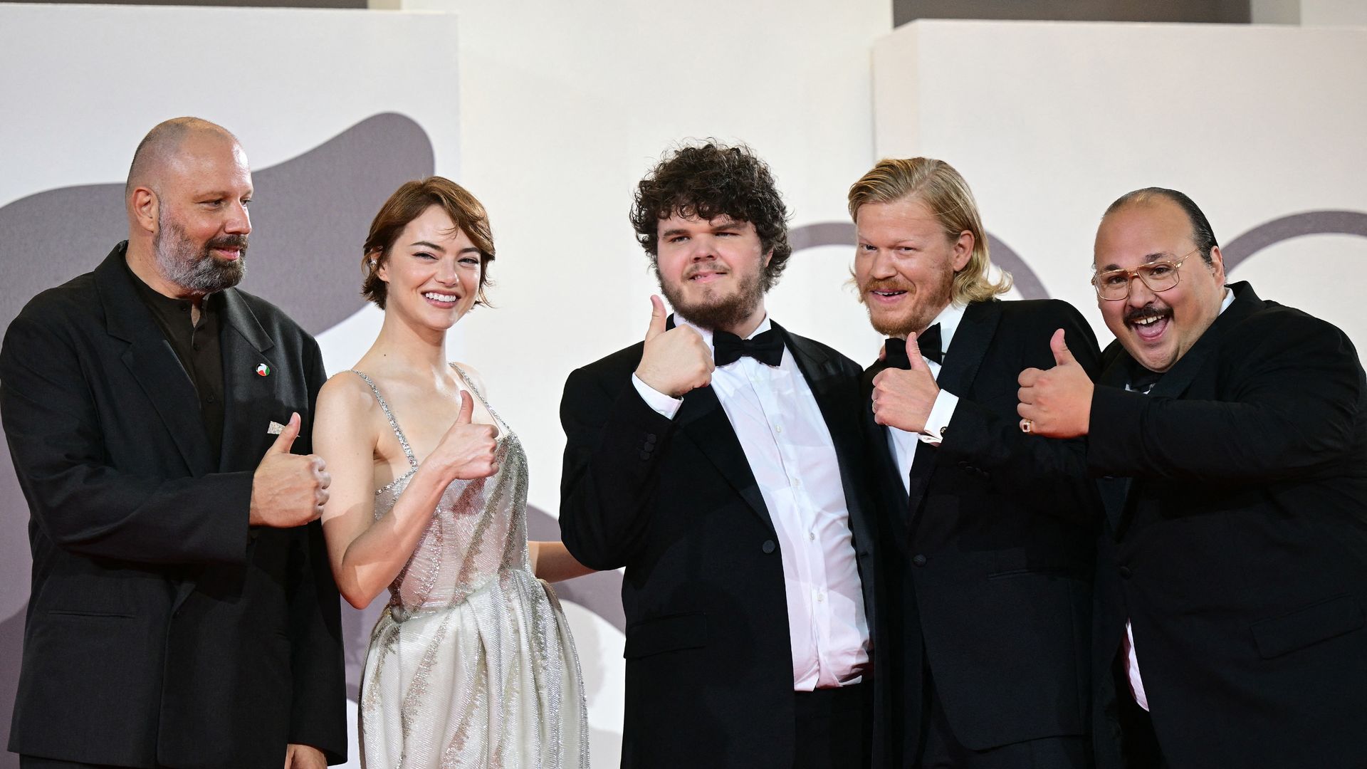 Greek director and screenwriter Yorgos Lanthimos, US actress Emma Stone, US actor Aidan Delbis, US actor Jesse Plemons and US actor Stavros Emmanuel Halkias, also known as Stavvy pose on the red carpet before the screening of the movie "Bugonia" presented in competition at the 82nd International Venice Film Festival, at Venice Lido on August 28, 2025.