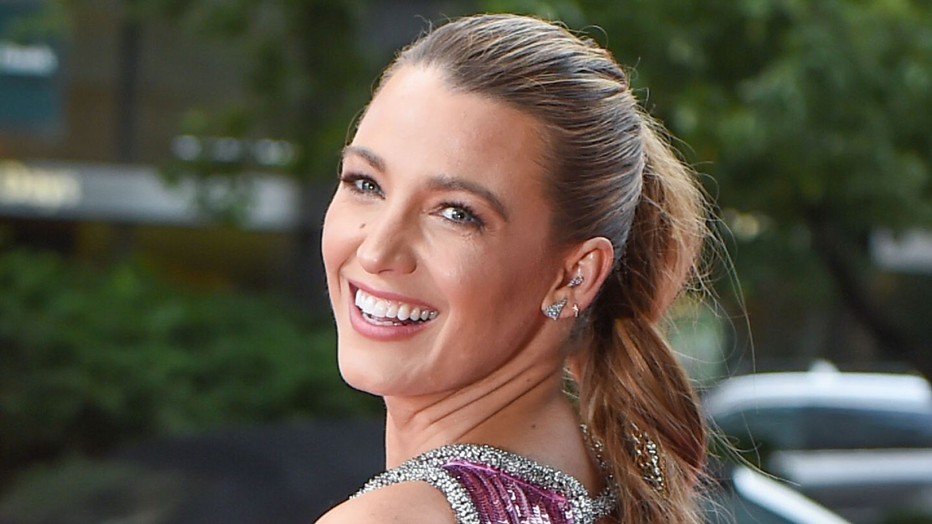 Blake Lively stuns in a red mini dress for a heartfelt occasion
